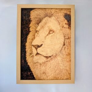 Close up portrait of a lion looking to the left, done using pyrography